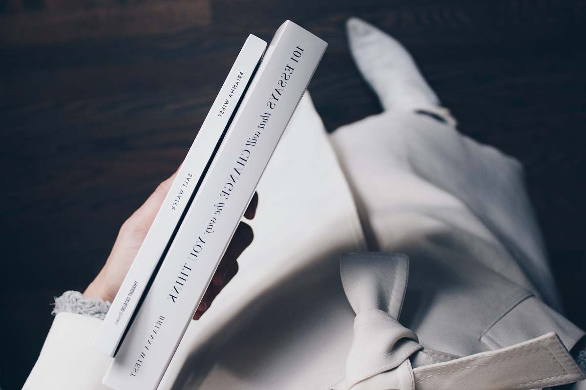 book person holding books holding