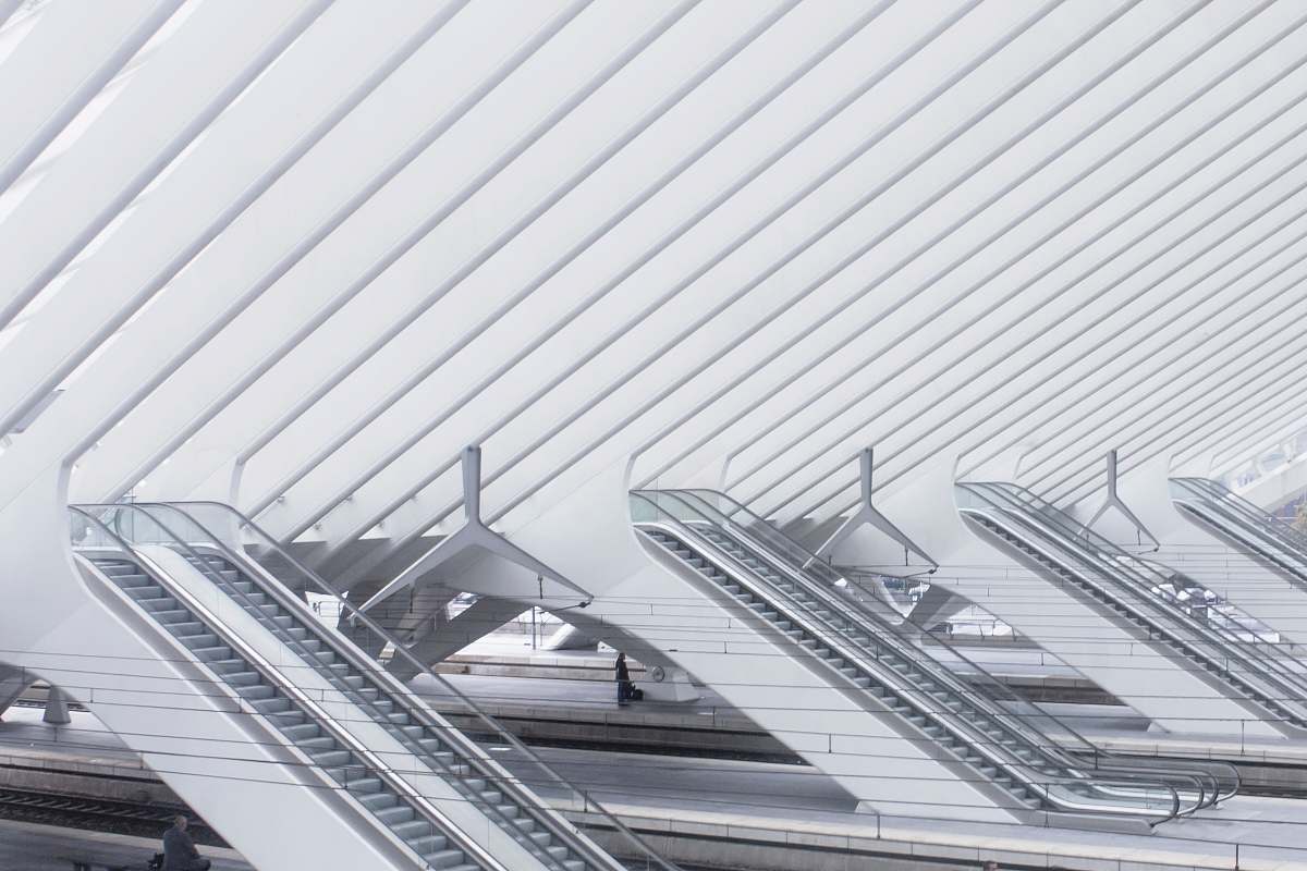 building photo of white escalators liège