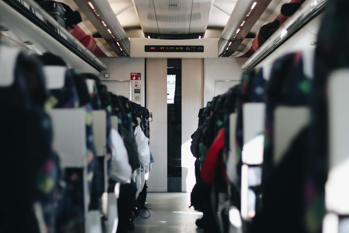 train photography of people sitting in vehicle seating