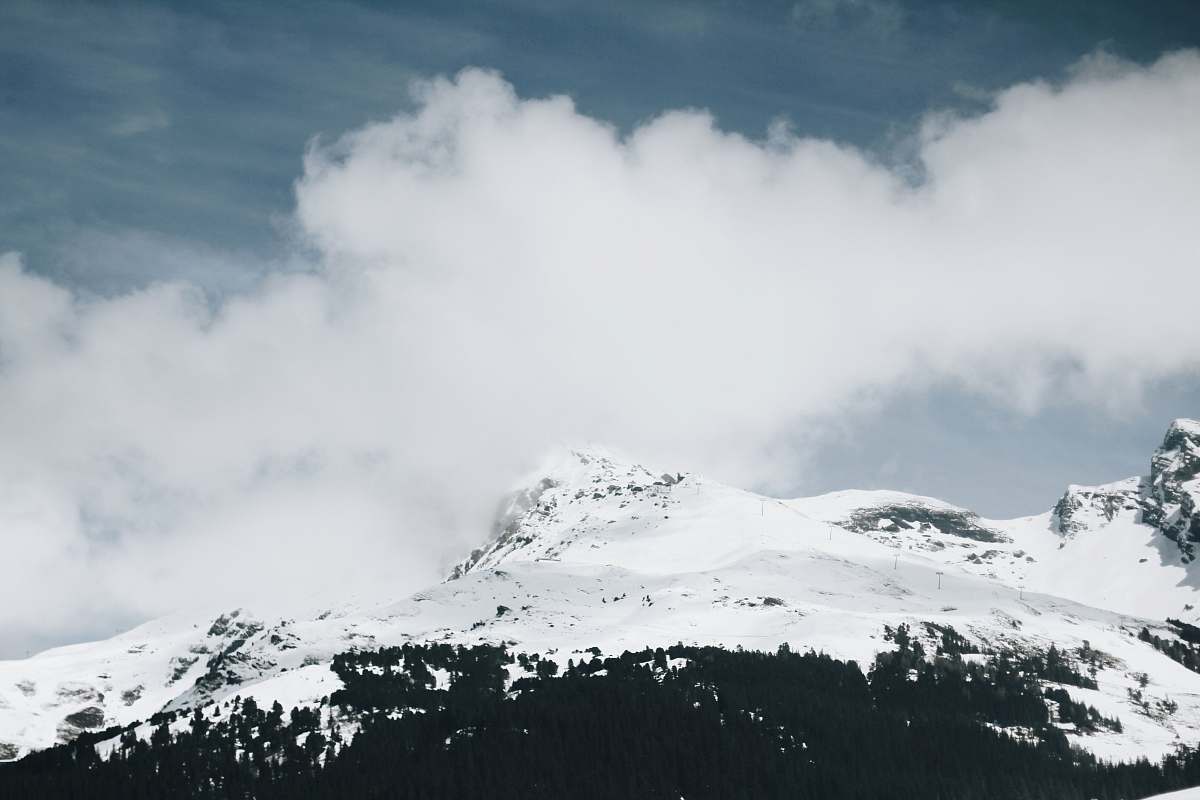 cloud snow-covered mountain under cloudy sky during daytime mountain
