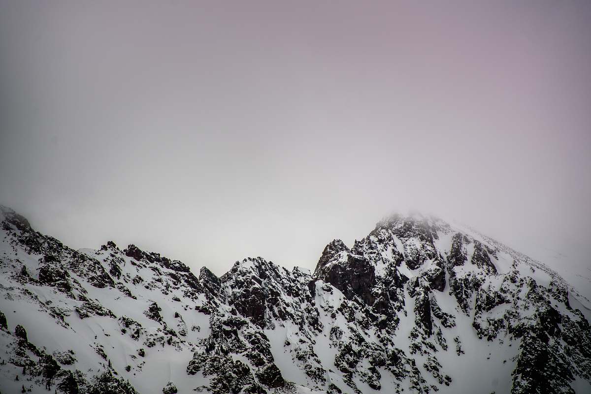 snow snow covered mountain under gray cloudy sky mountain