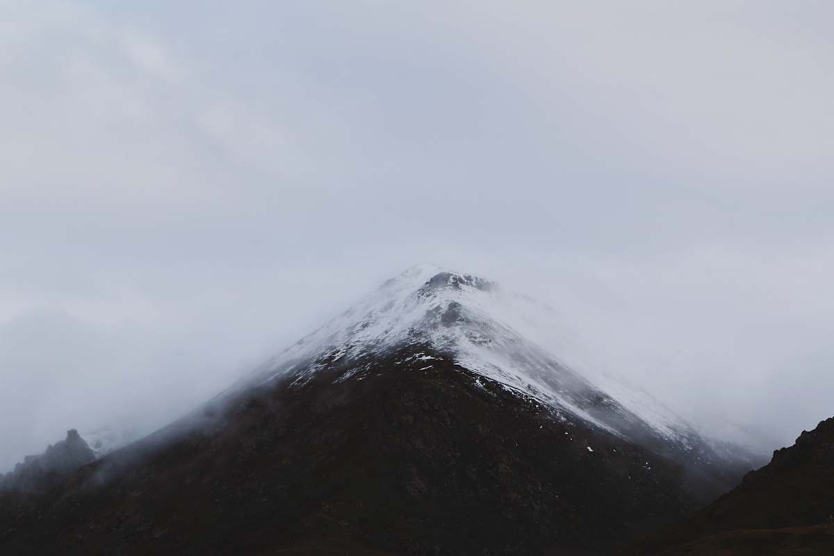 mountain snow mountain summit under clouds peak