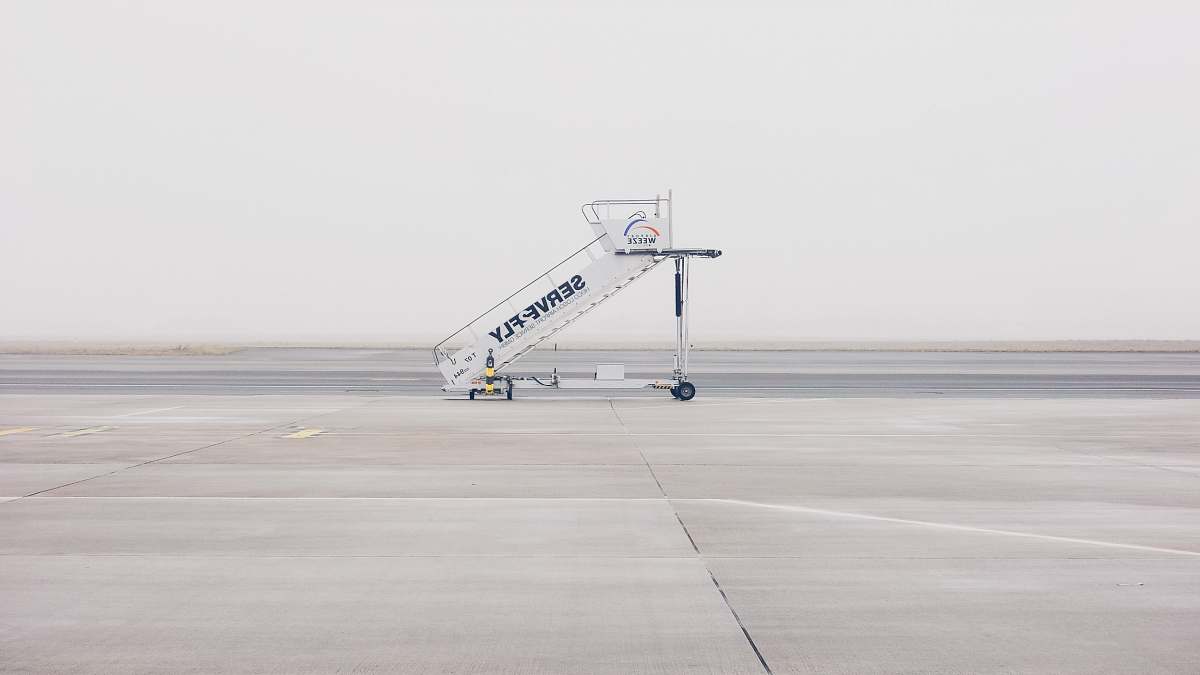 weeze white airliner stairs on runway airplane