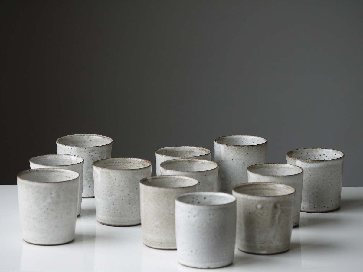 pottery white cup lot on white surface white