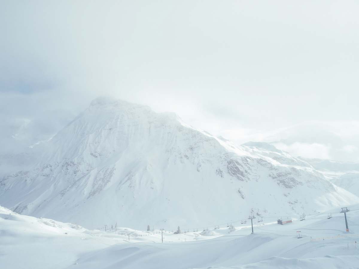 mountain white mountain filled with snow under white sky snow