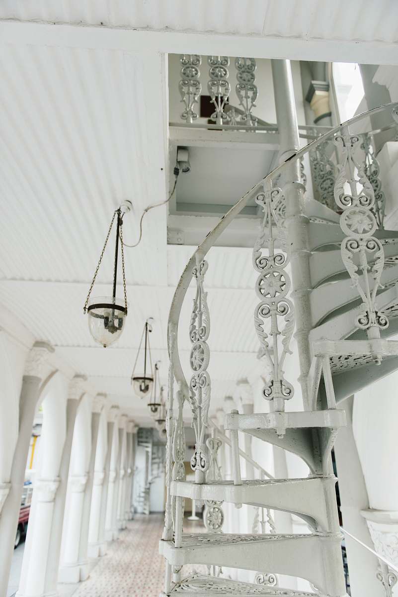 staircase white spiral stairs near pendant lamp white