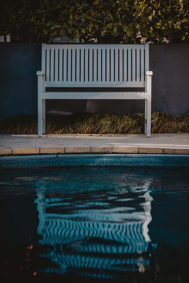 furniture white wooden bench near outdoor pool bench