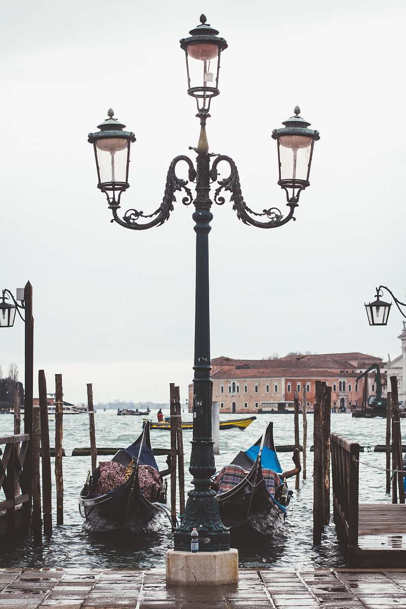 person black and gray metal lamp post lamp post