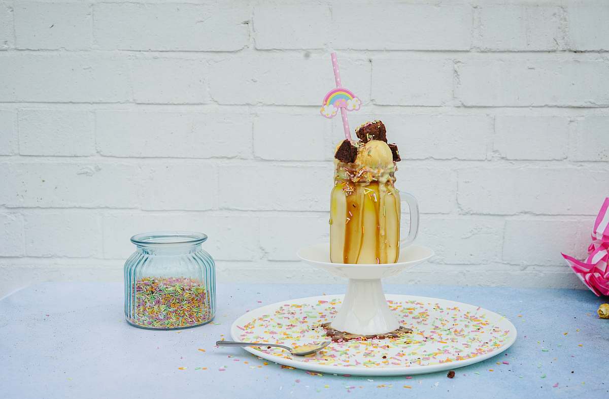 person caramel milkshake jar