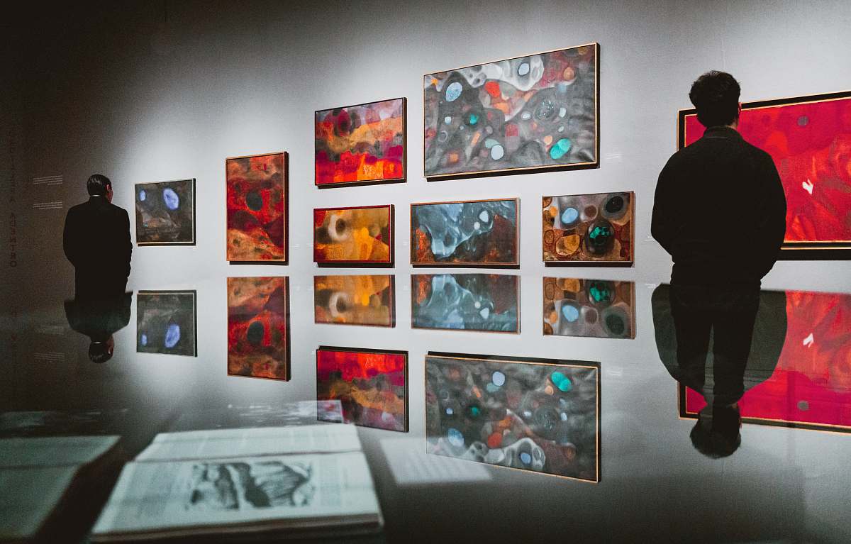 person man facing artworks art