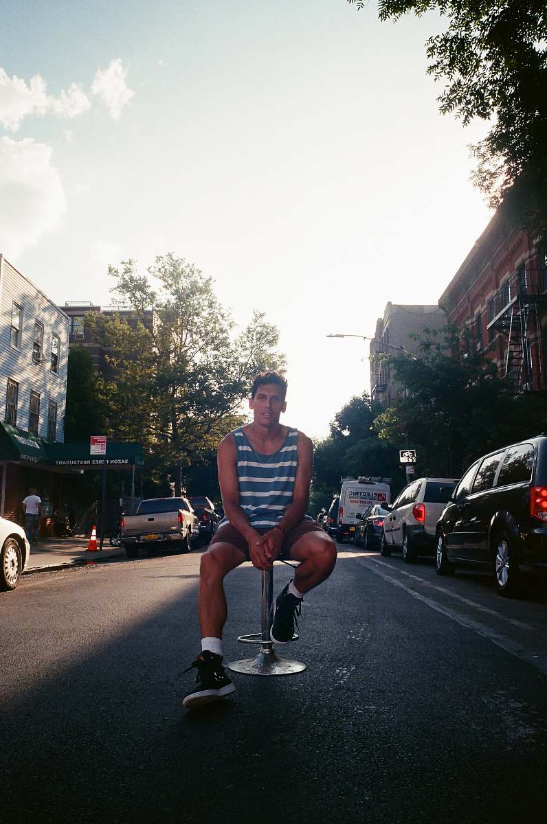 person man sitting on stall automobile