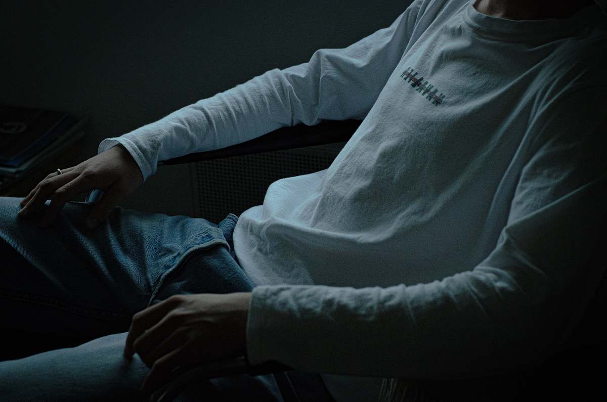 person man wearing white long-sleeved shirt grey