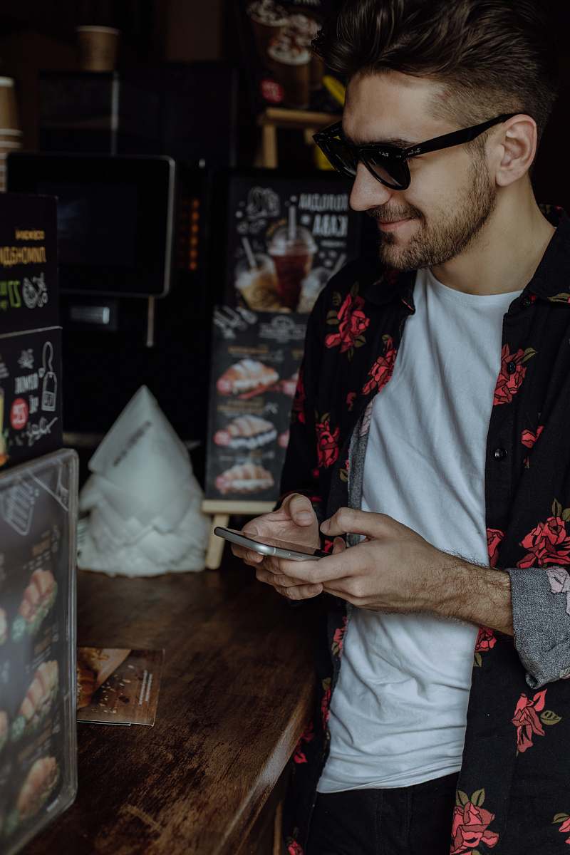 person unknown person using smartphone indoors accessories