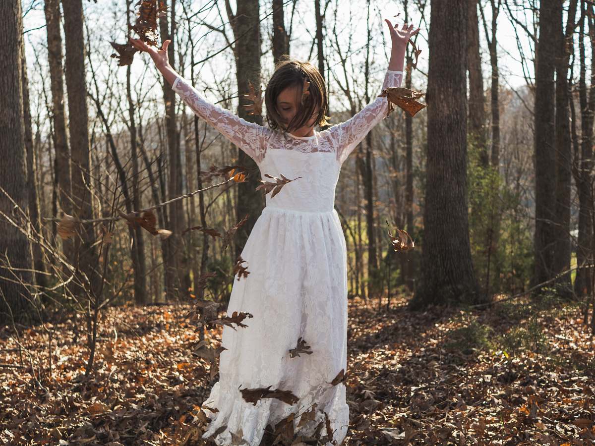person woman raising her hands people