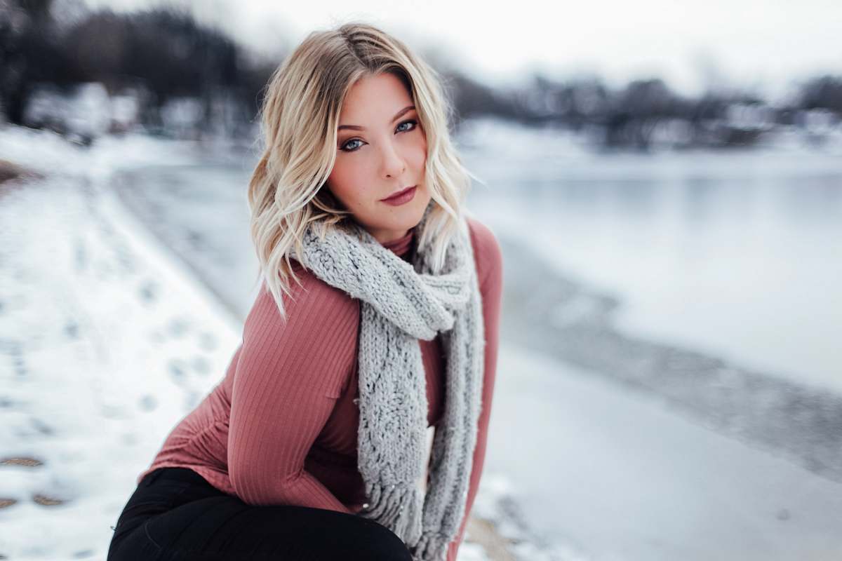 person woman with gray scarf near body of water during daytime people