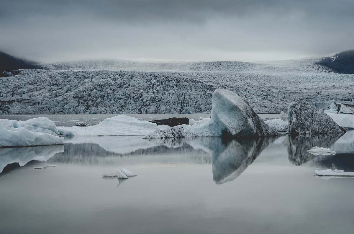 grey ice berg on body of water glacier