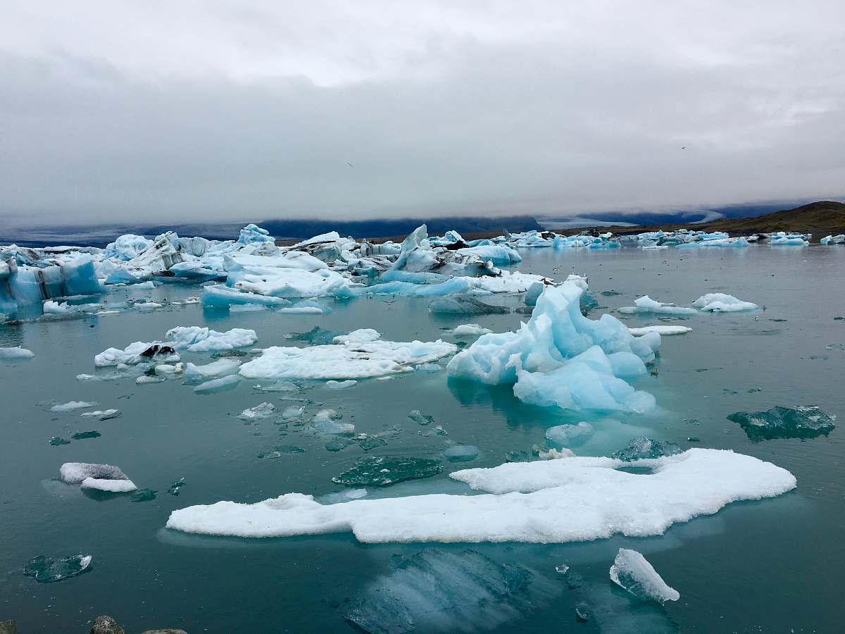 iceberg ice burg on body of water outdoors