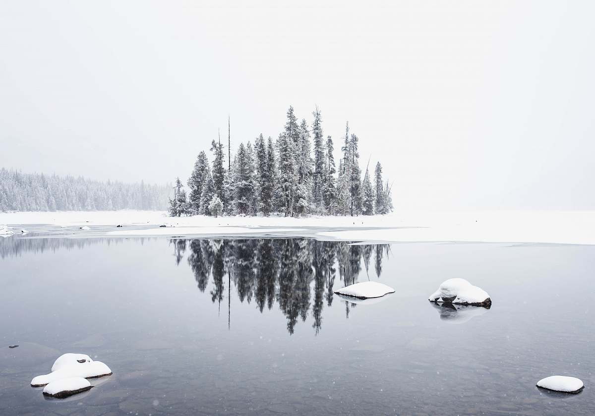 rock snowfield and body of water water