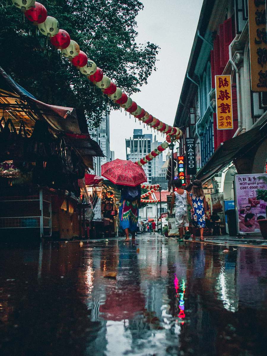 lantern group of people between restaurants umbrella