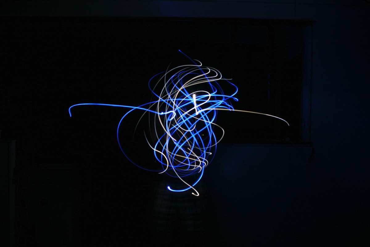 neon blue and white light streaks sphere