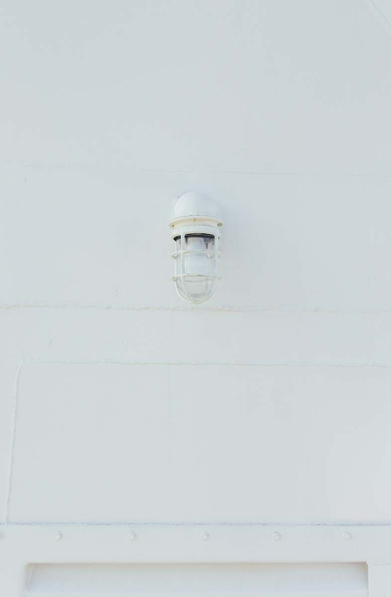 white white lamp mounted on wall grey