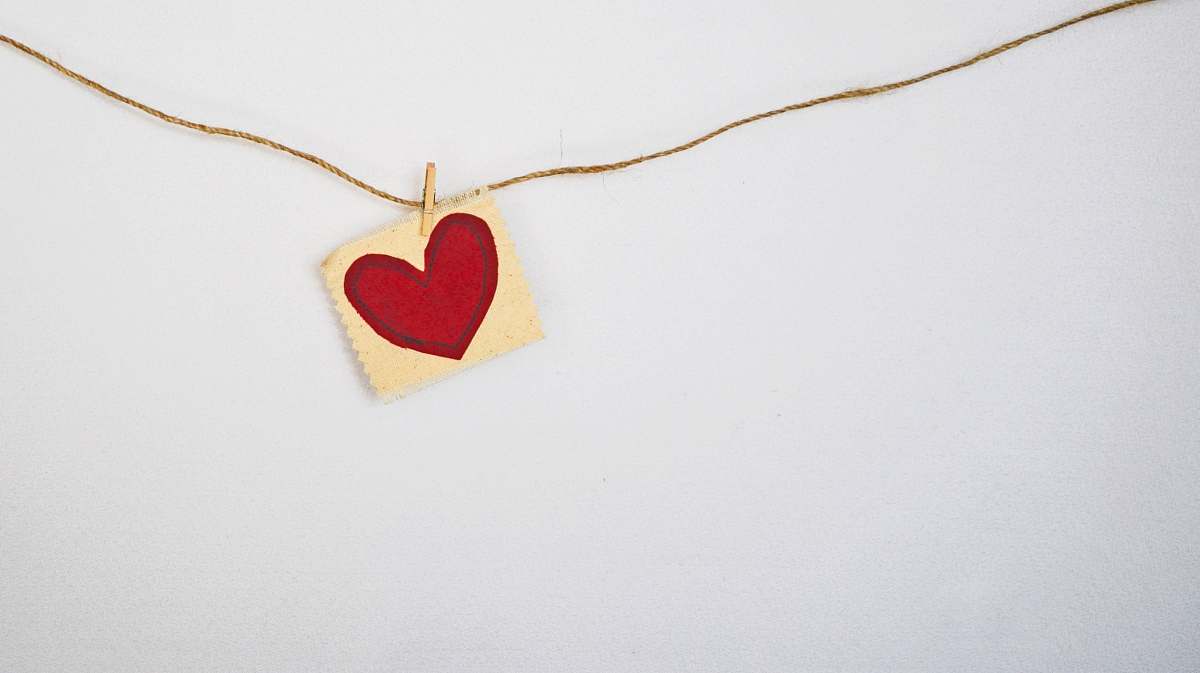 heart heart-shaped red and beige pendant white background