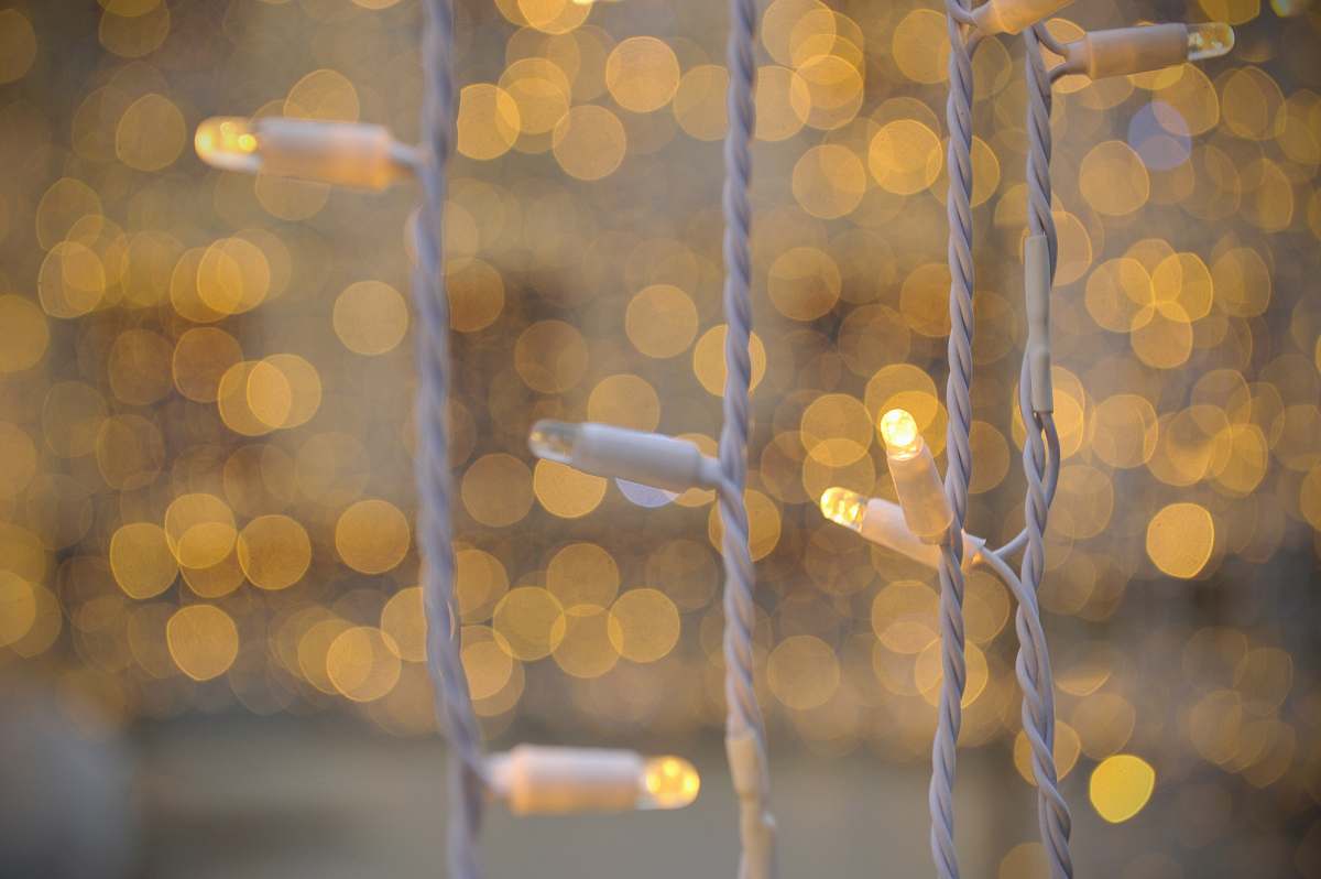 russia selective focus photo of white string lights bokeh