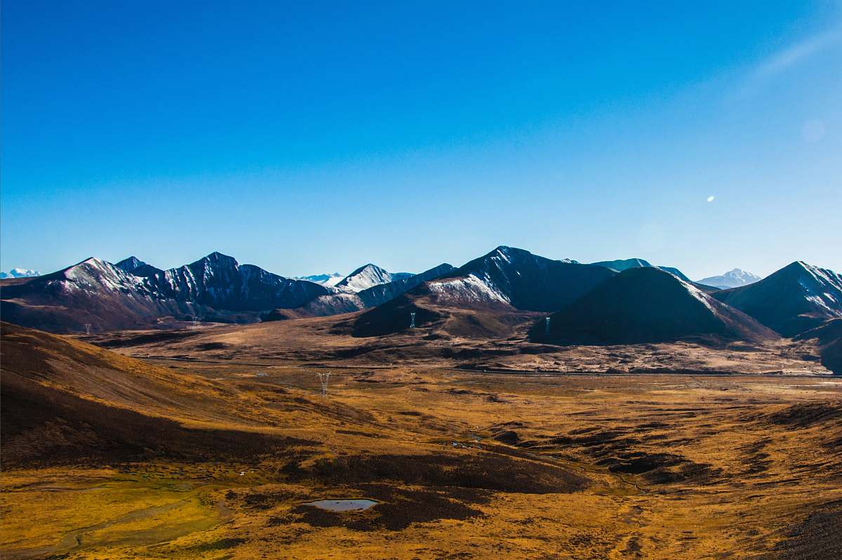 nature aerial photography of snow-capped mountain range field