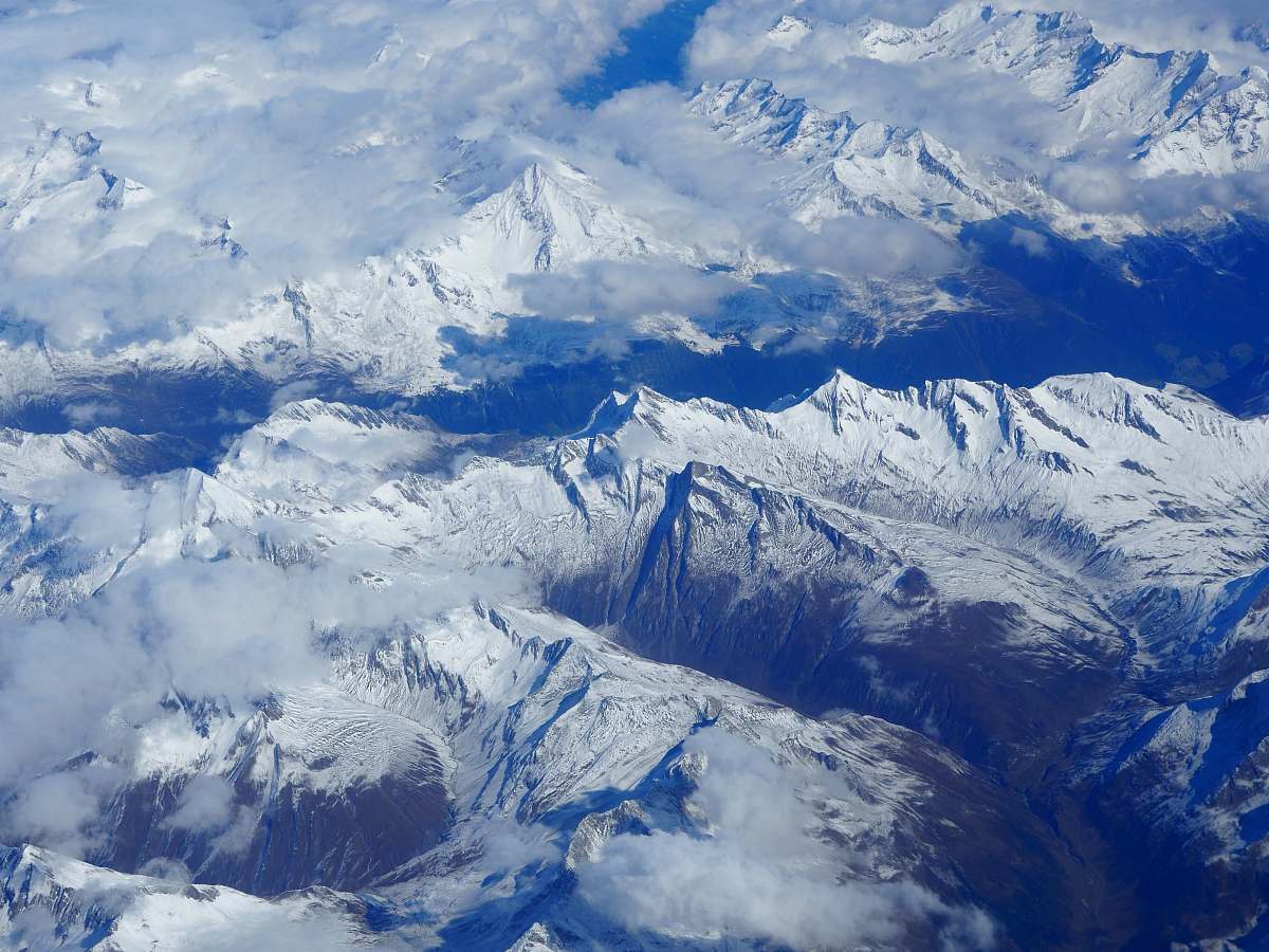 snow aerial photography of snow-coated mountains alps