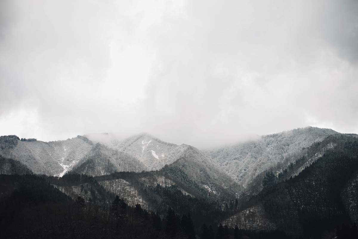 nature grayscale photo of mountain at daytime alps