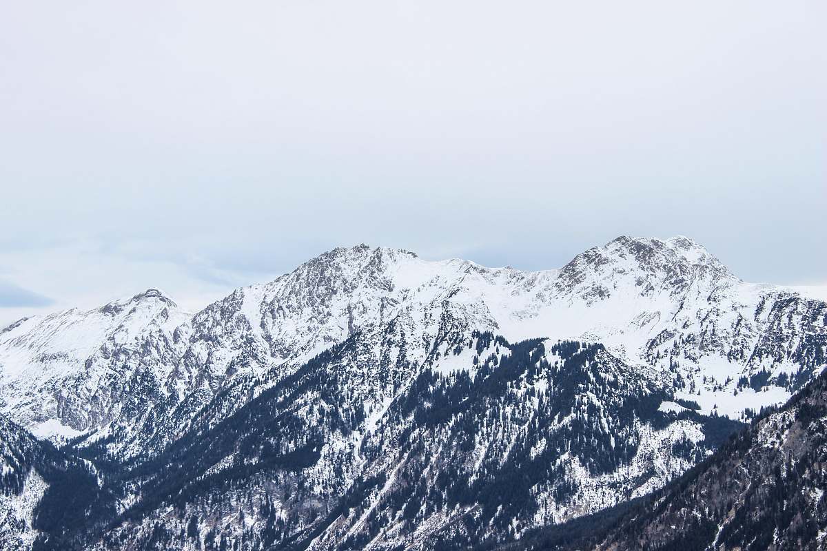 alps mountain covered by snow at daytime nature