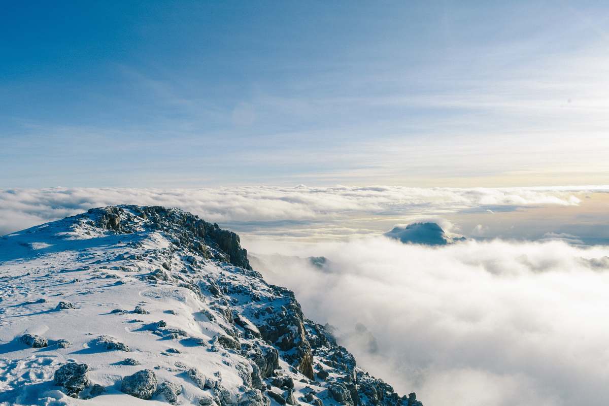 nature mountain covered by snow near sea of clouds snow