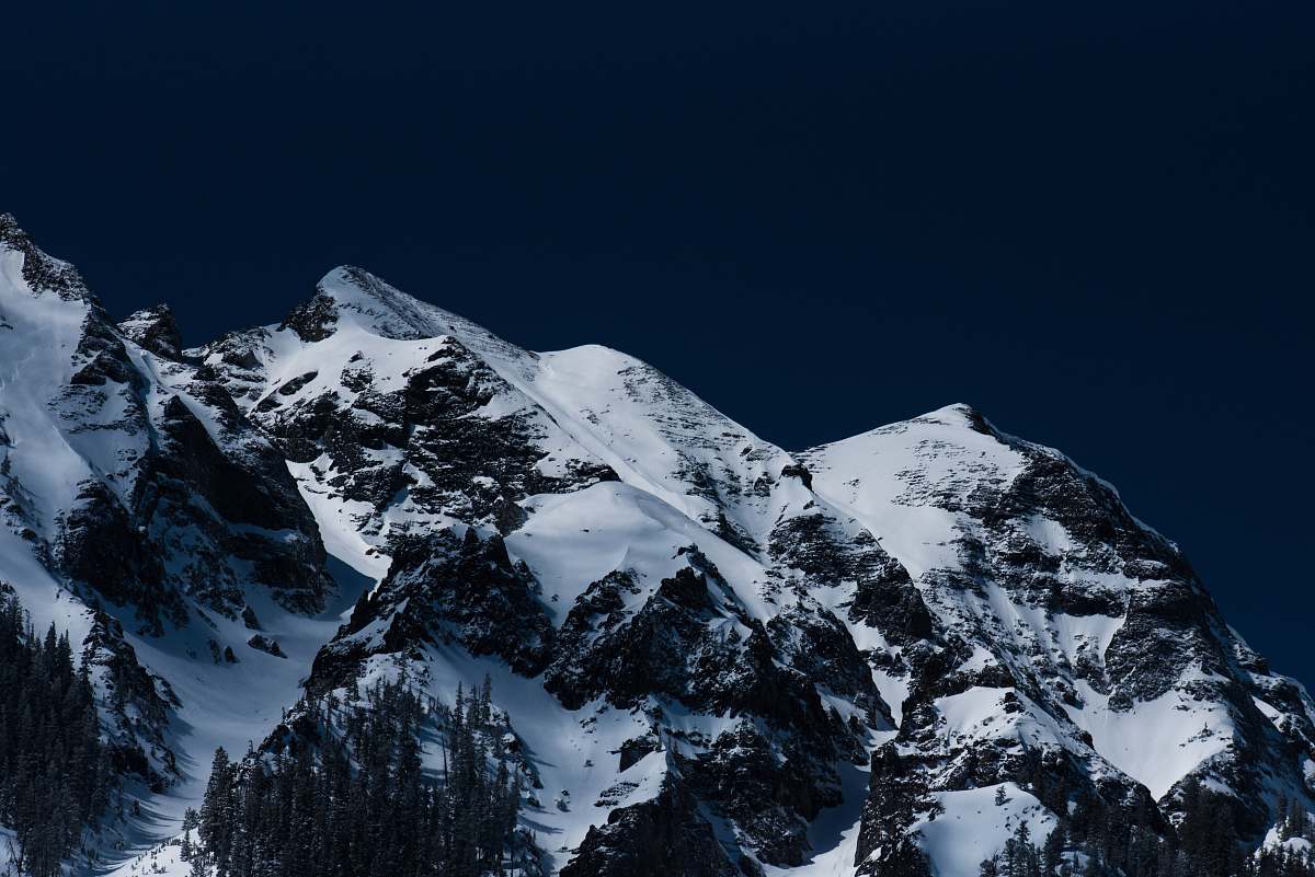 peak mountains with white snow during daytime mountain range