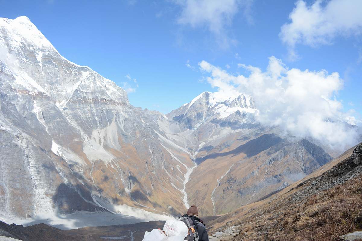 nature person on top of mountain snow