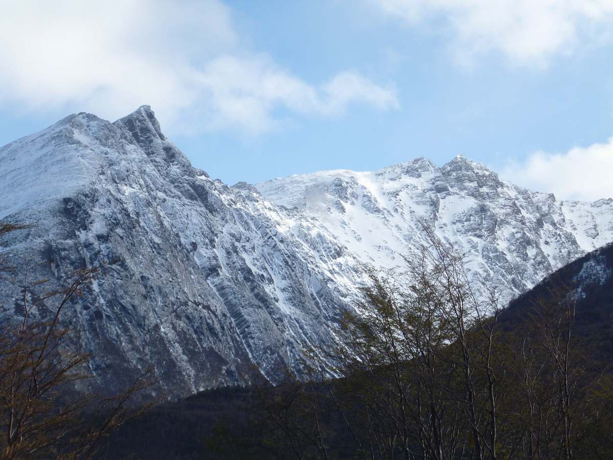 nature snow coated mountain during daytime mountain range