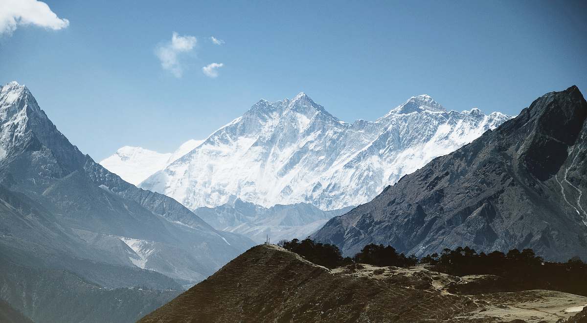 nature snow coated mountains during daytime outdoors