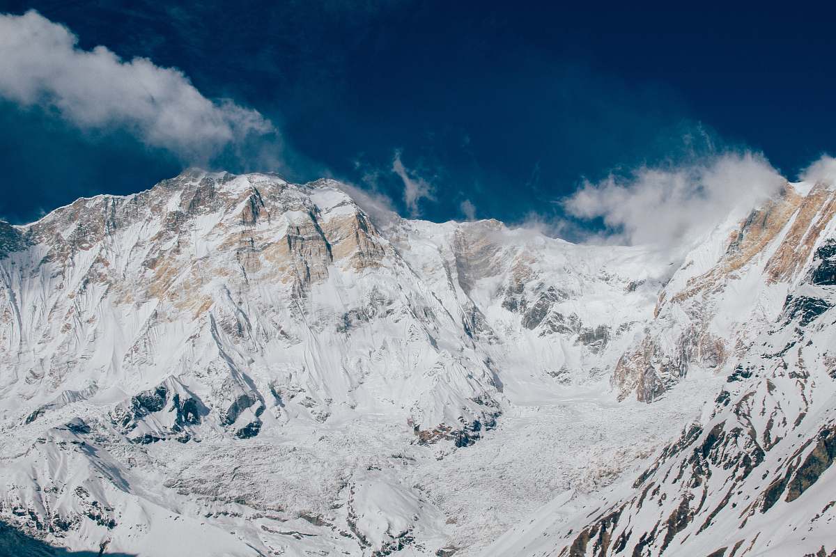 mountain glacier mountain under white and blue sky snow