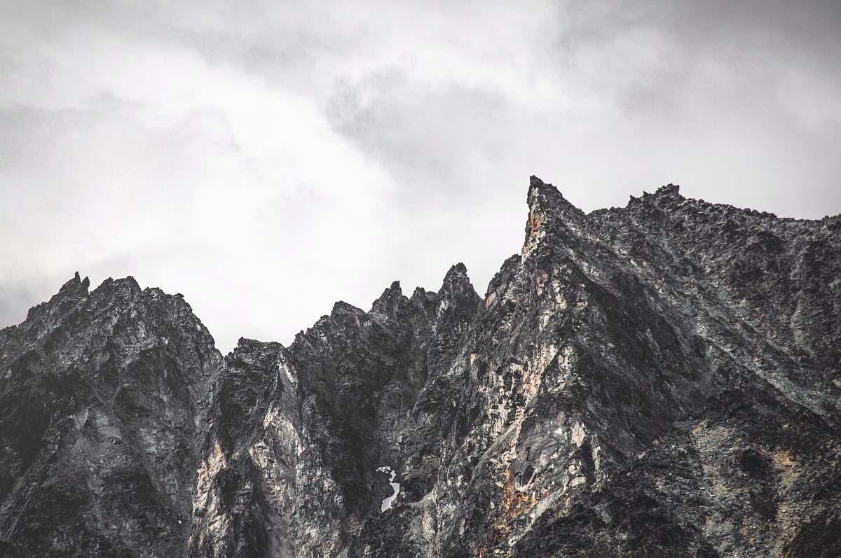outdoors gray rocky mountain under cloudy sky mountain