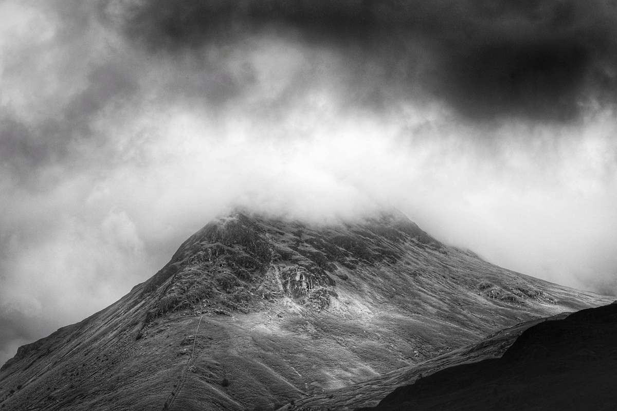 black-and-white grayscale photo of foggy mountain mountain