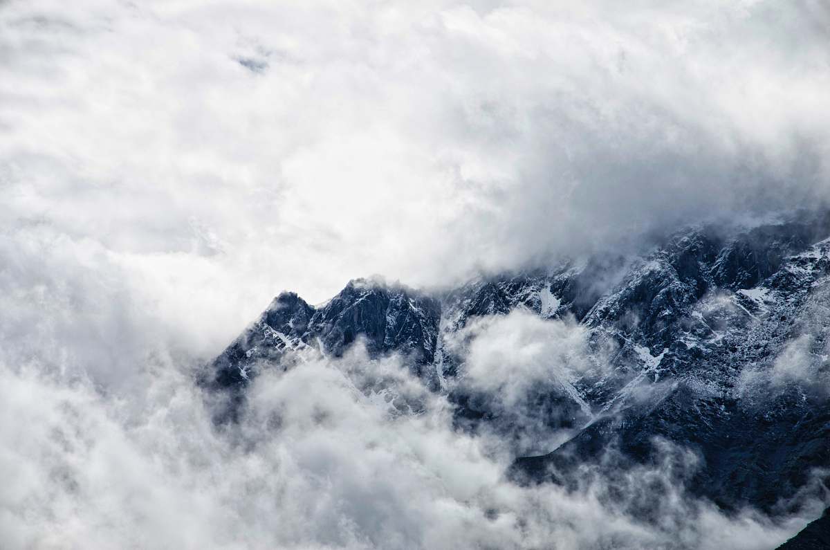 mountain mountain covered with clouds clouds