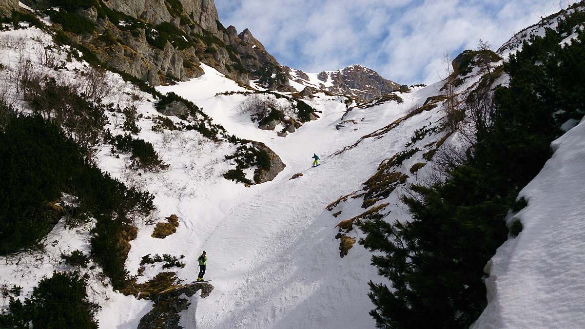 mountain person snowboarding on mountain covered with snow snow