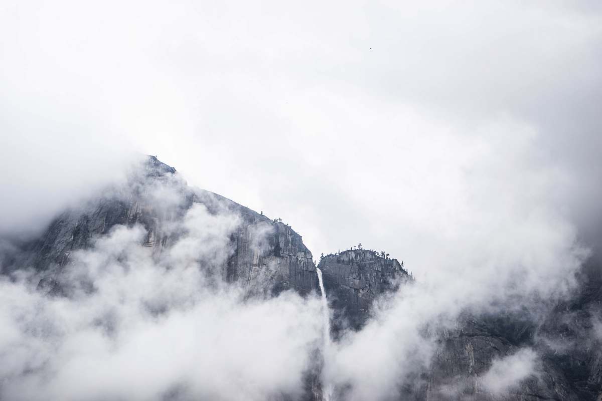 mountain photo of mountain under white clouds at daytime clouds