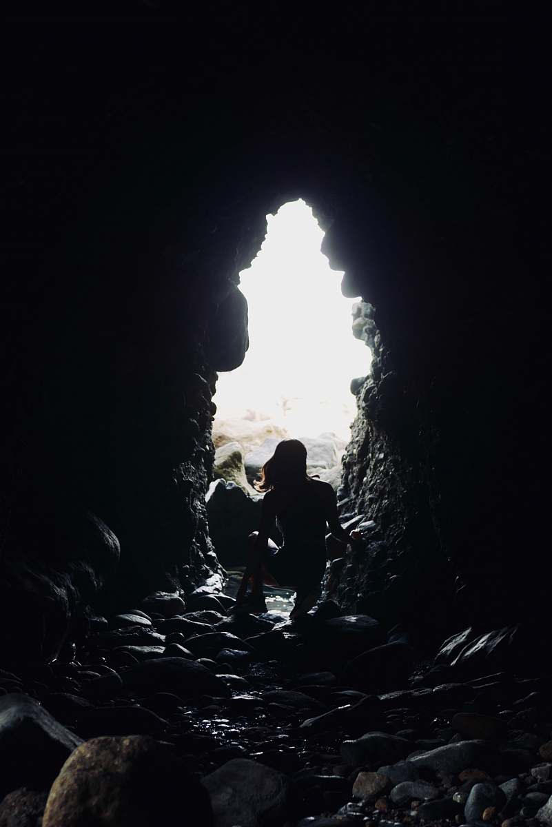 human silhouette of person on tunnel cave