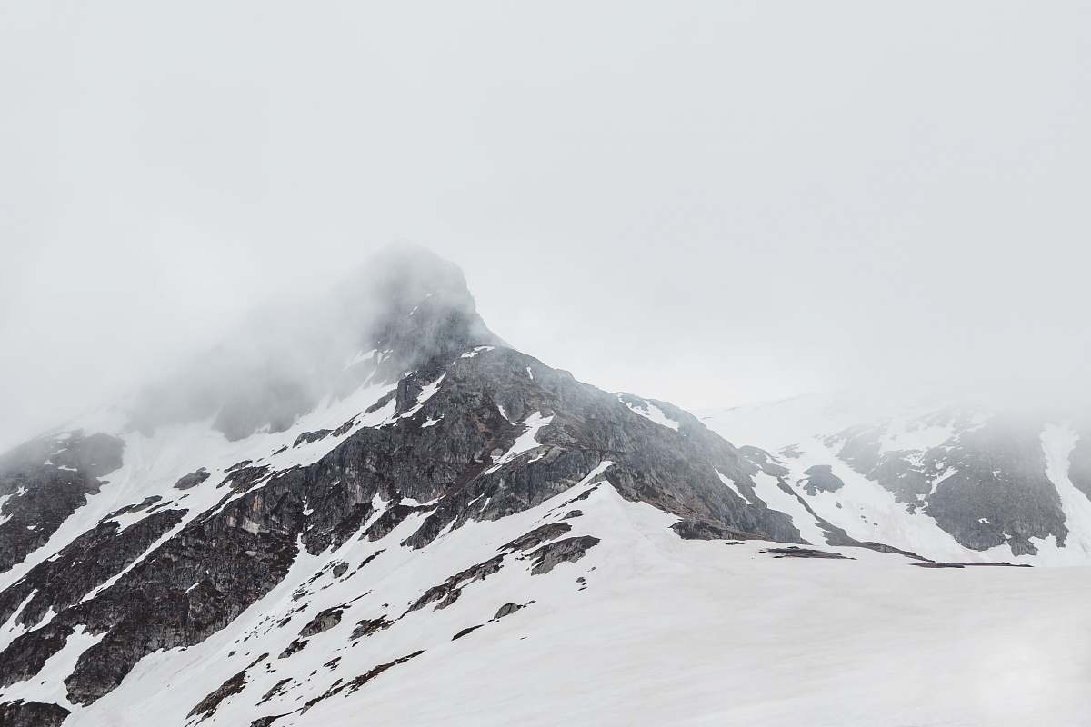 grey snow covered mountain top mountain