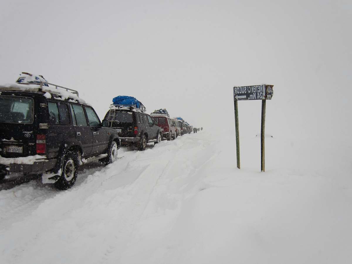 snow vehicle near sign outdoors