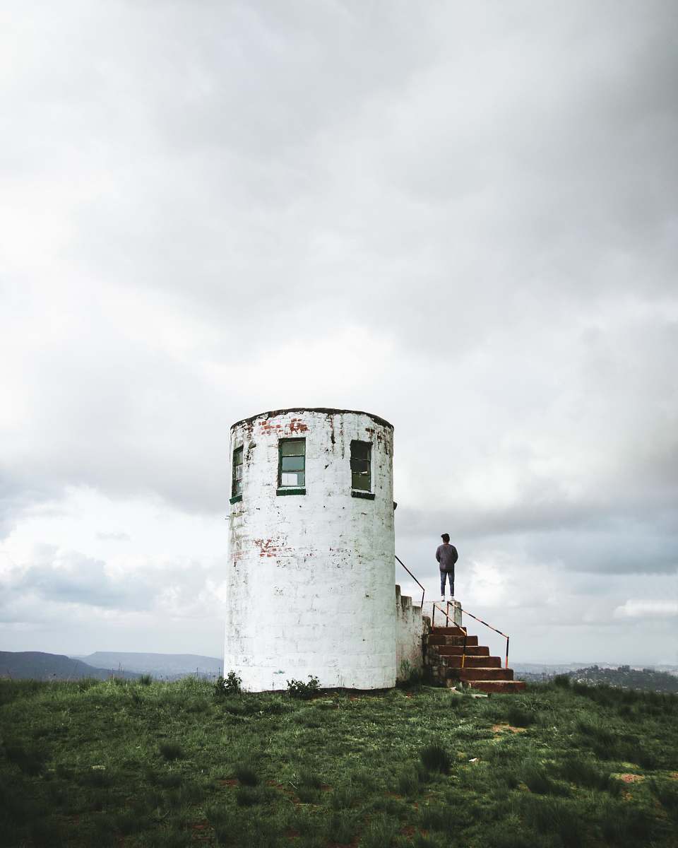 human white stone tower building person