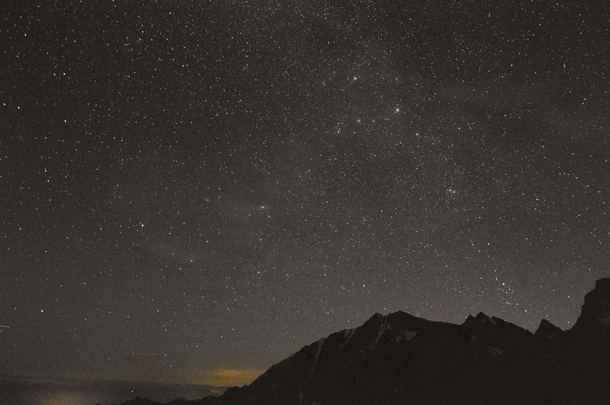 universe silhouette of mountain under gray sky stars