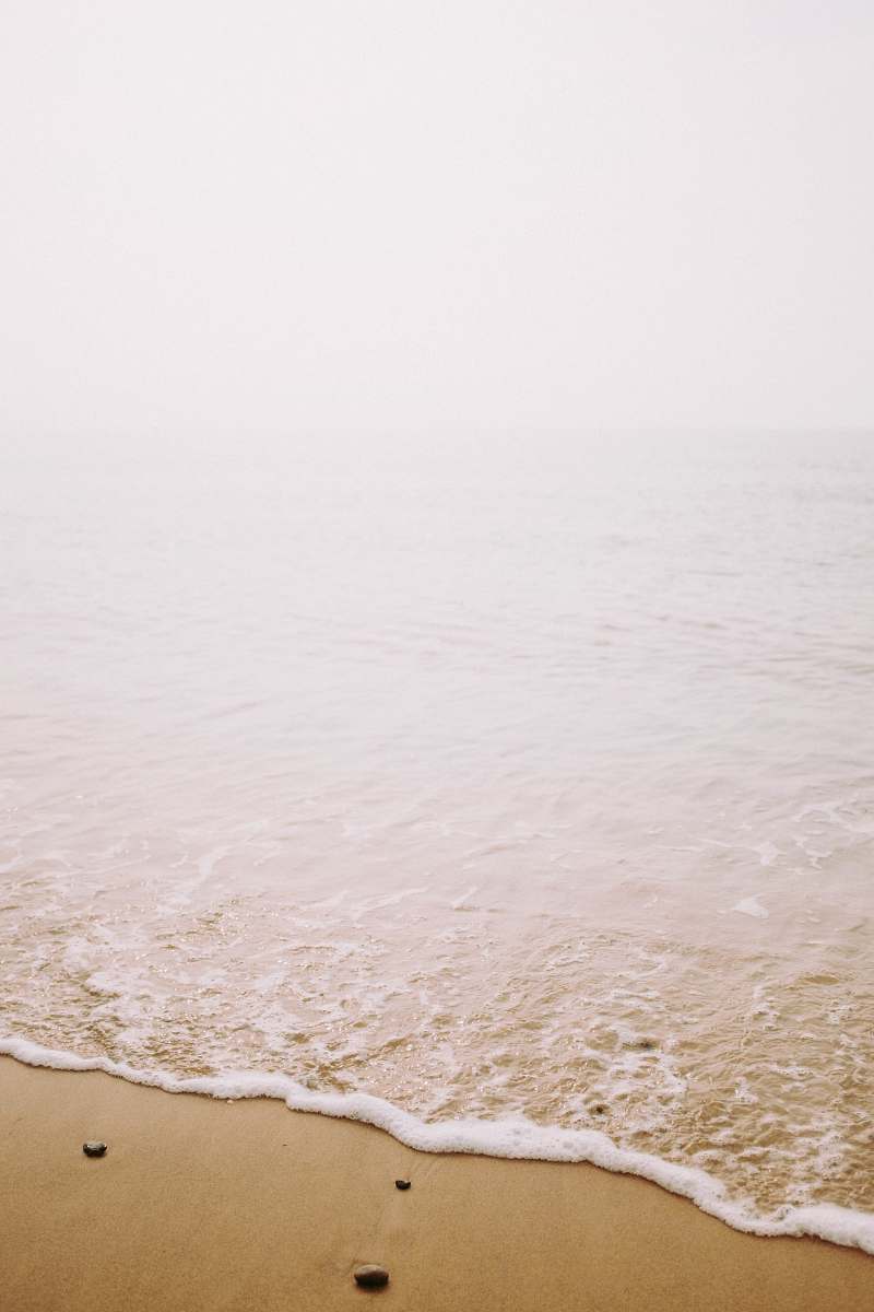 water seashore with gray stones sea