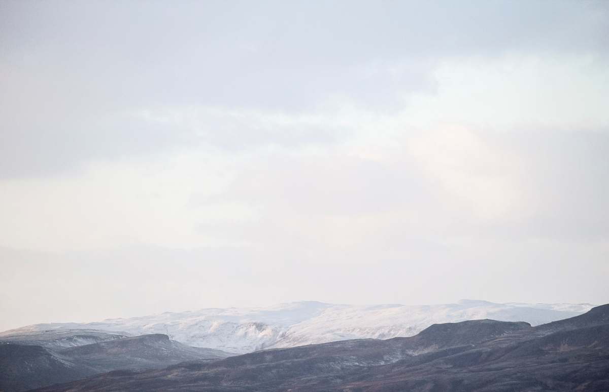 mountain mountain view under white skies nature