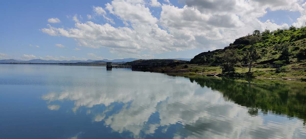 reservoir reflection of clouds on body of water during daytime veer dam